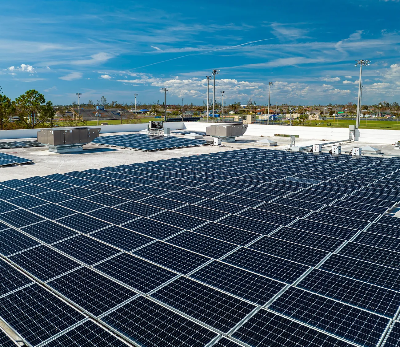 Aerial view of solar panels mounted on industrial building roof