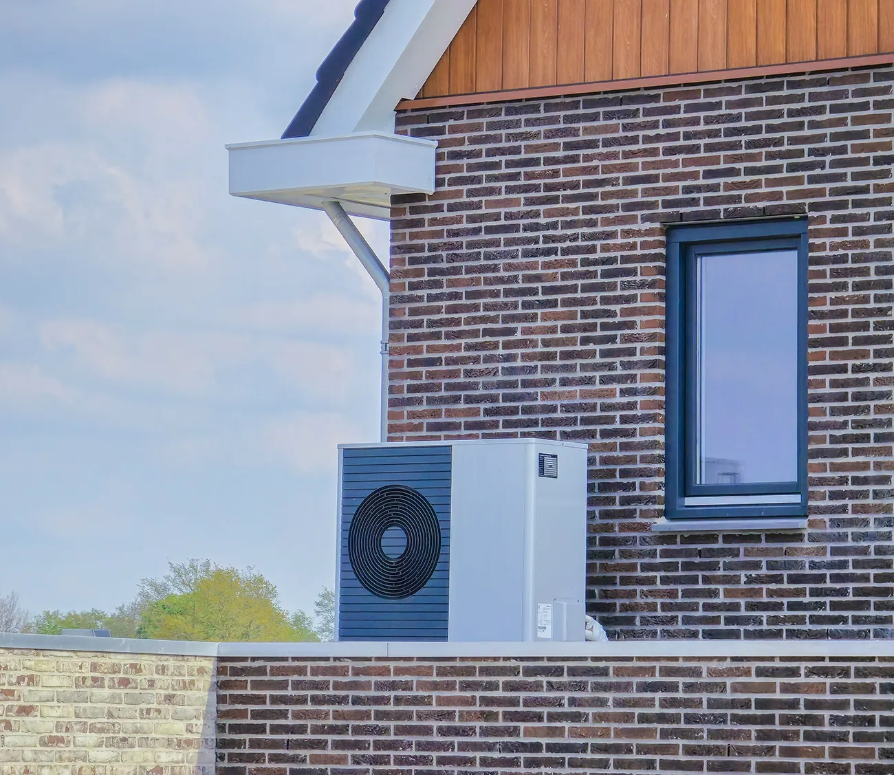 Air source heat pump unit installed outdoors